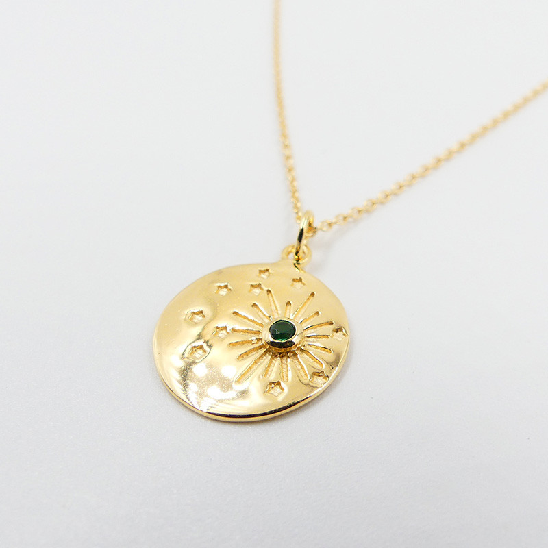 Médaille dorée constellation