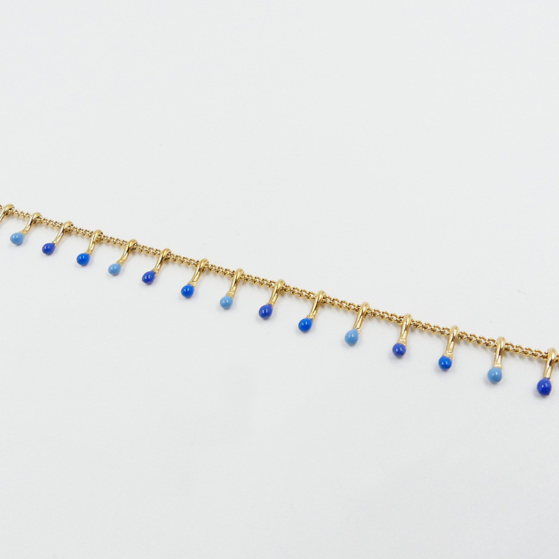 Bracelet acier dorée avec gouttes bleues