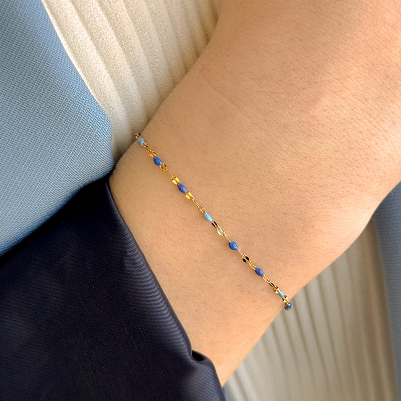 Bracelet acier doré perles vertes ou bleues