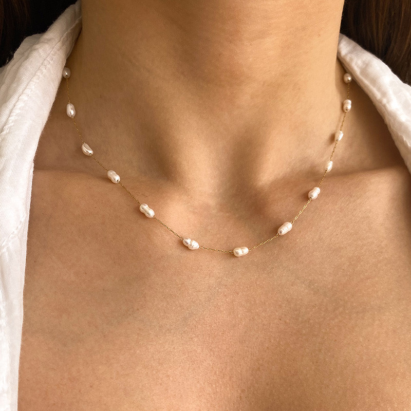 Collier acier doré perles d'eau douce