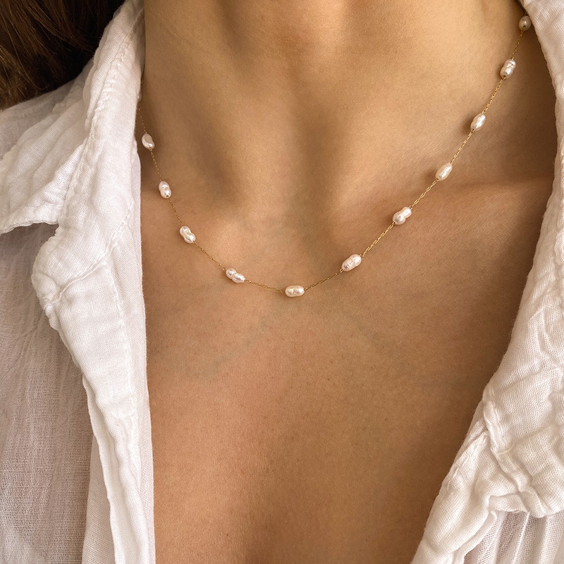 Collier acier doré perles d'eau douce