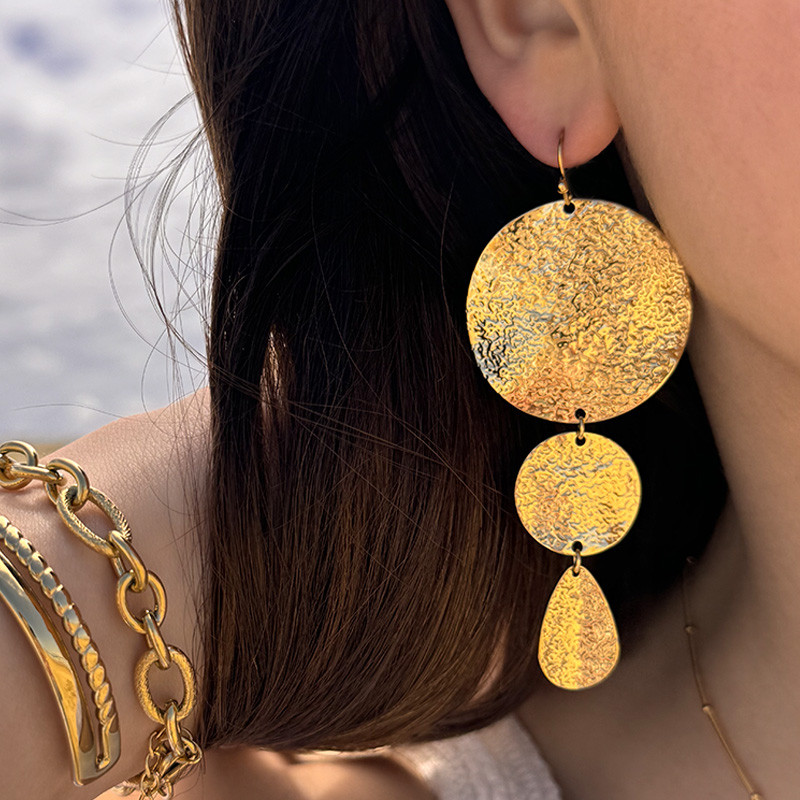 Boucles d’oreilles acier pendantes pétales