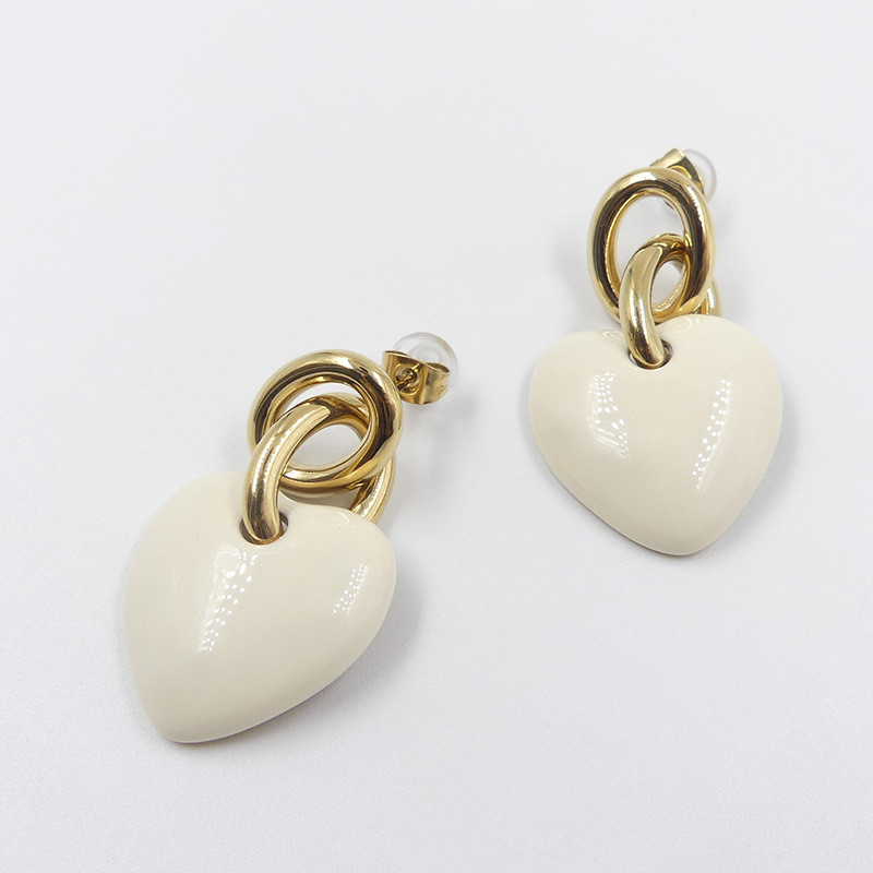 Boucles d’oreilles acier doré coeur blanc