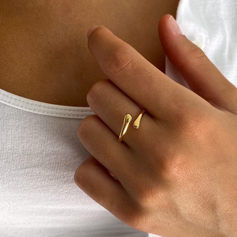 Bague acier doré enlacée ajustable fine