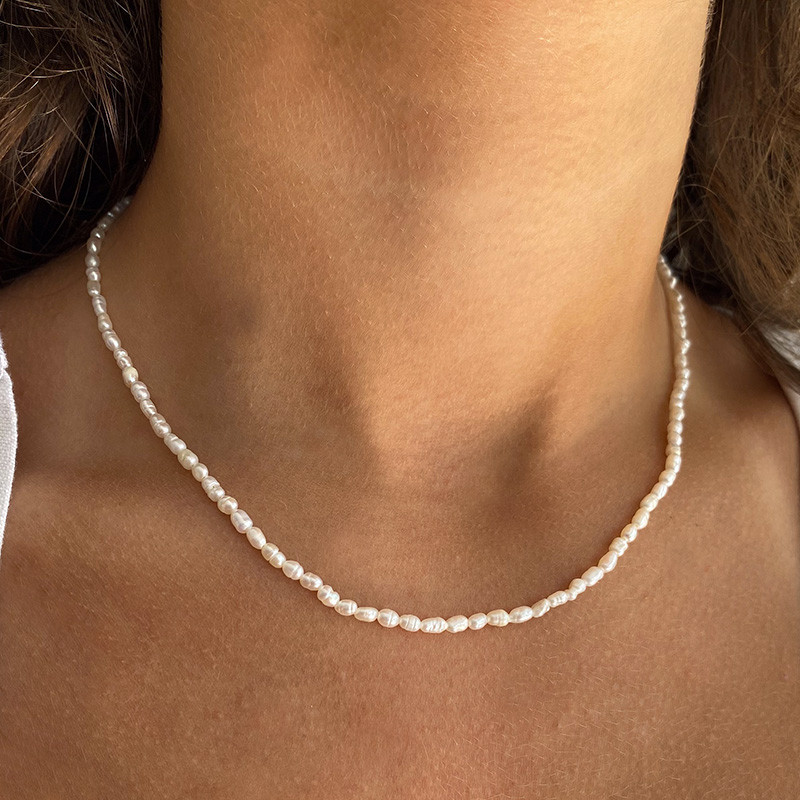 Collier acier doré perles d’eau douce