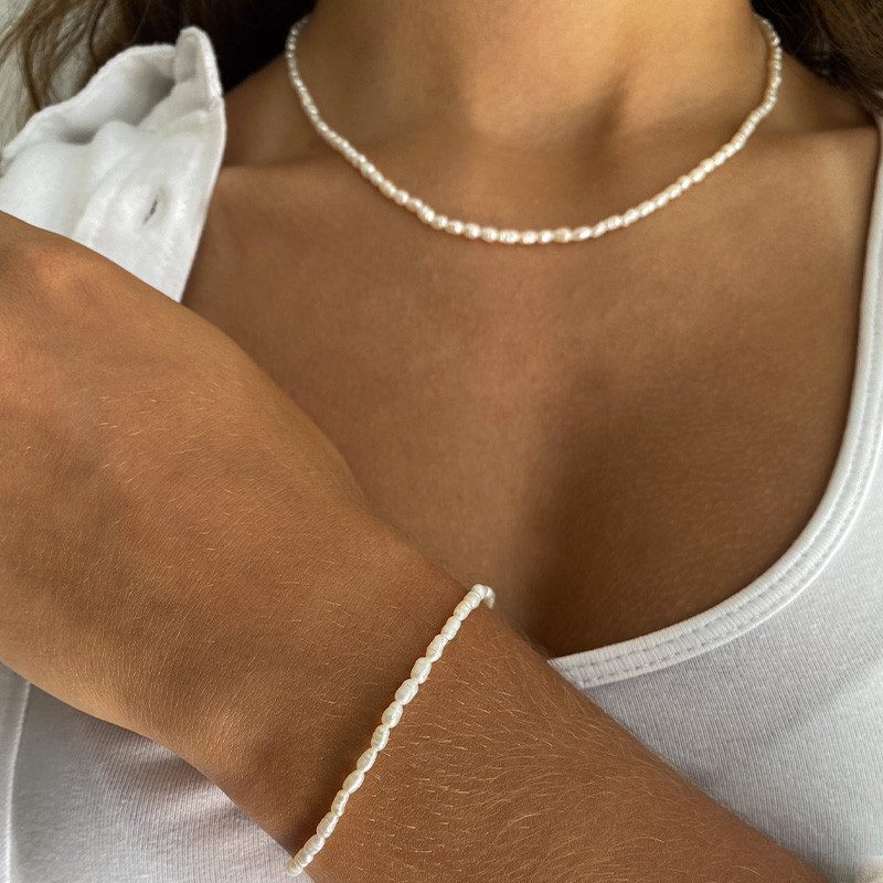 Collier acier doré perles d’eau douce