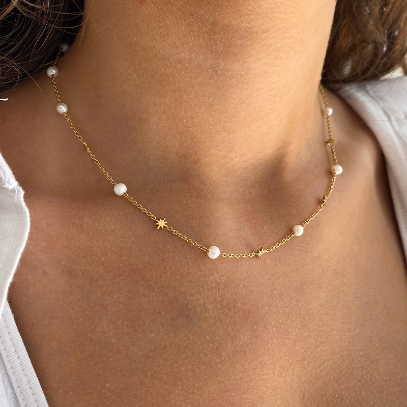Collier acier doré perles de culture et étoiles