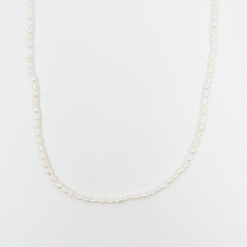 Collier acier doré perles d’eau douce