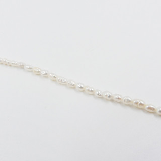 Collier acier doré perles d’eau douce