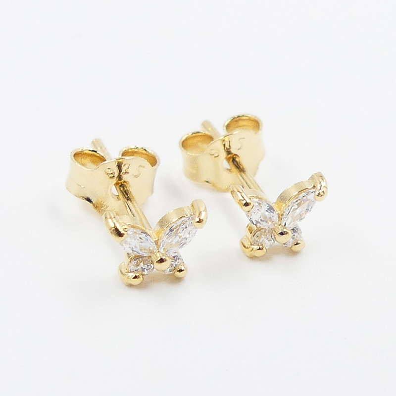Clous d'oreilles plaqué or papillon strass