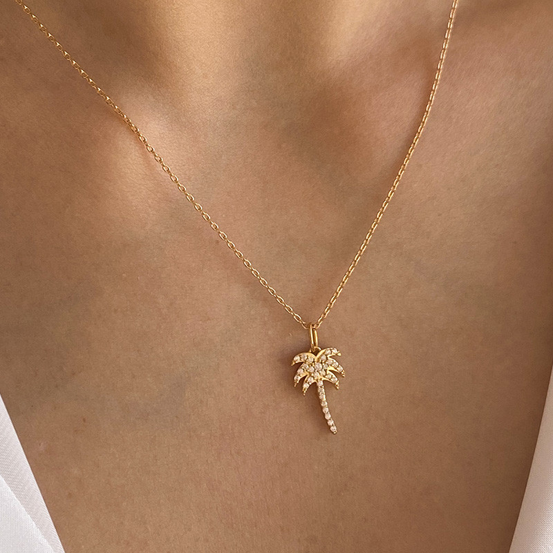 Charm's plaqué or palmier strass