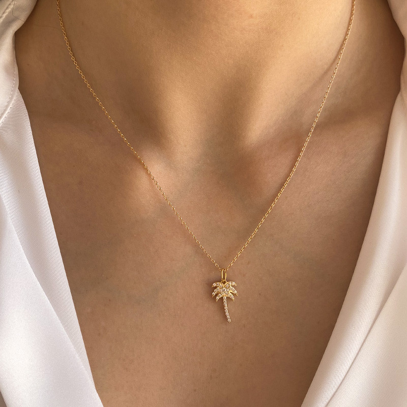 Charm's plaqué or palmier strass