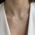 Collier or 18 carats et croix diamant