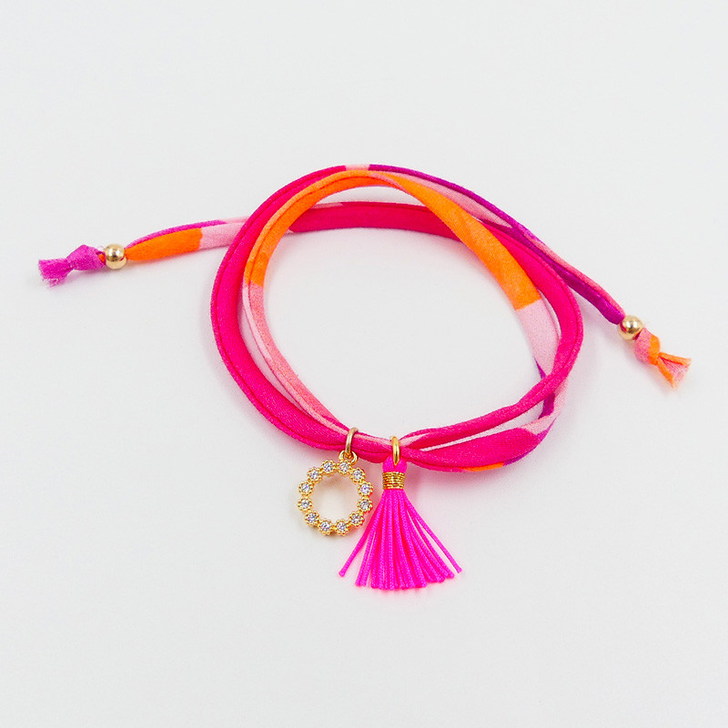 Bracelet Cordon Liberty doré couronne strass et pompon fuchsia