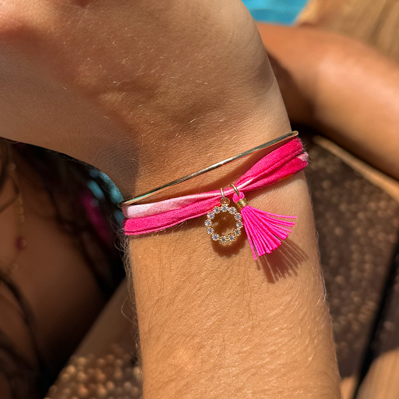 Bracelet Cordon Liberty doré couronne strass et pompon fuchsia