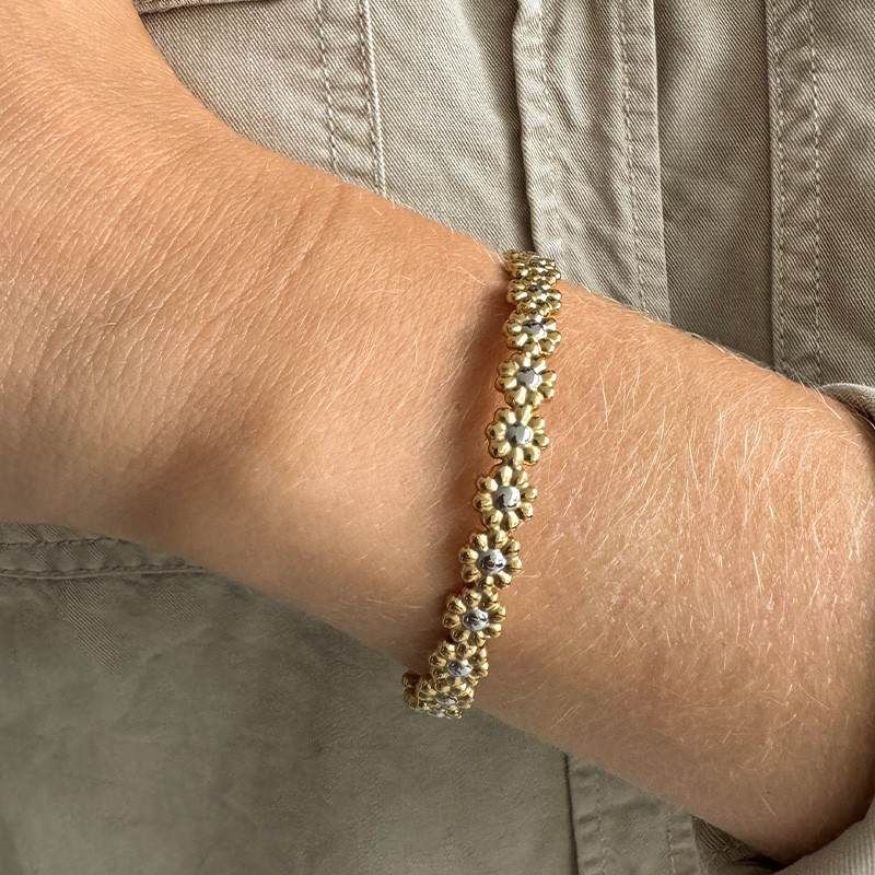 Jonc acier fleur mixte argent et doré