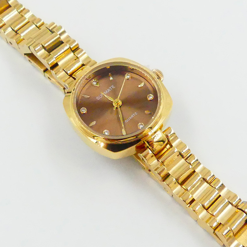 Montre doré cadran chocolat