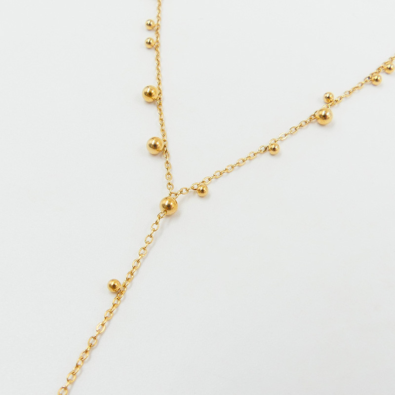 Collier cravate acier doré boule