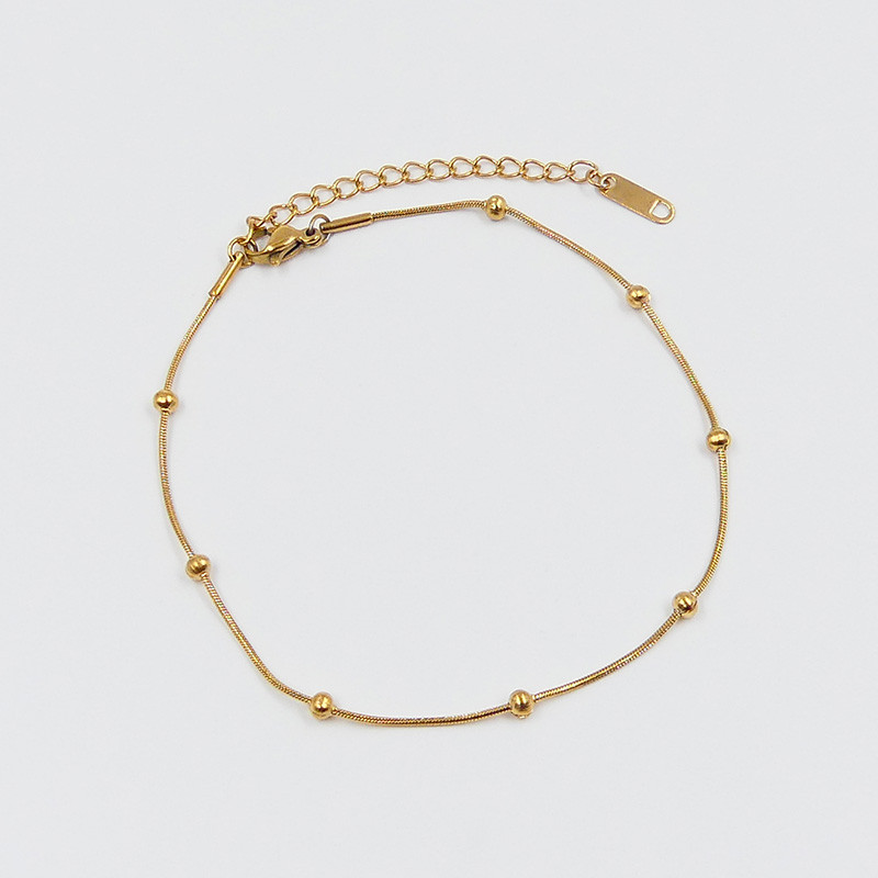 Chaîne de cheville acier doré avec boules