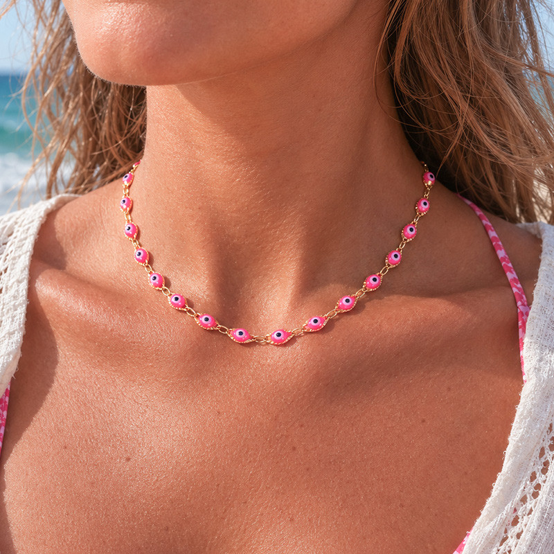 Collier femme œil fuchsia
